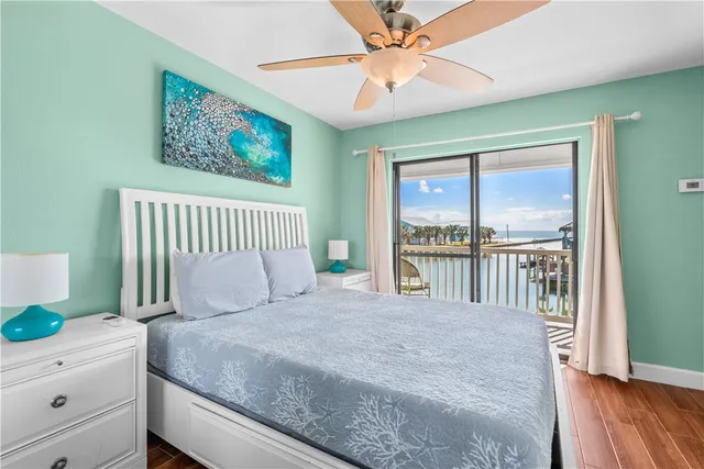 a bedroom with a large bed and a window