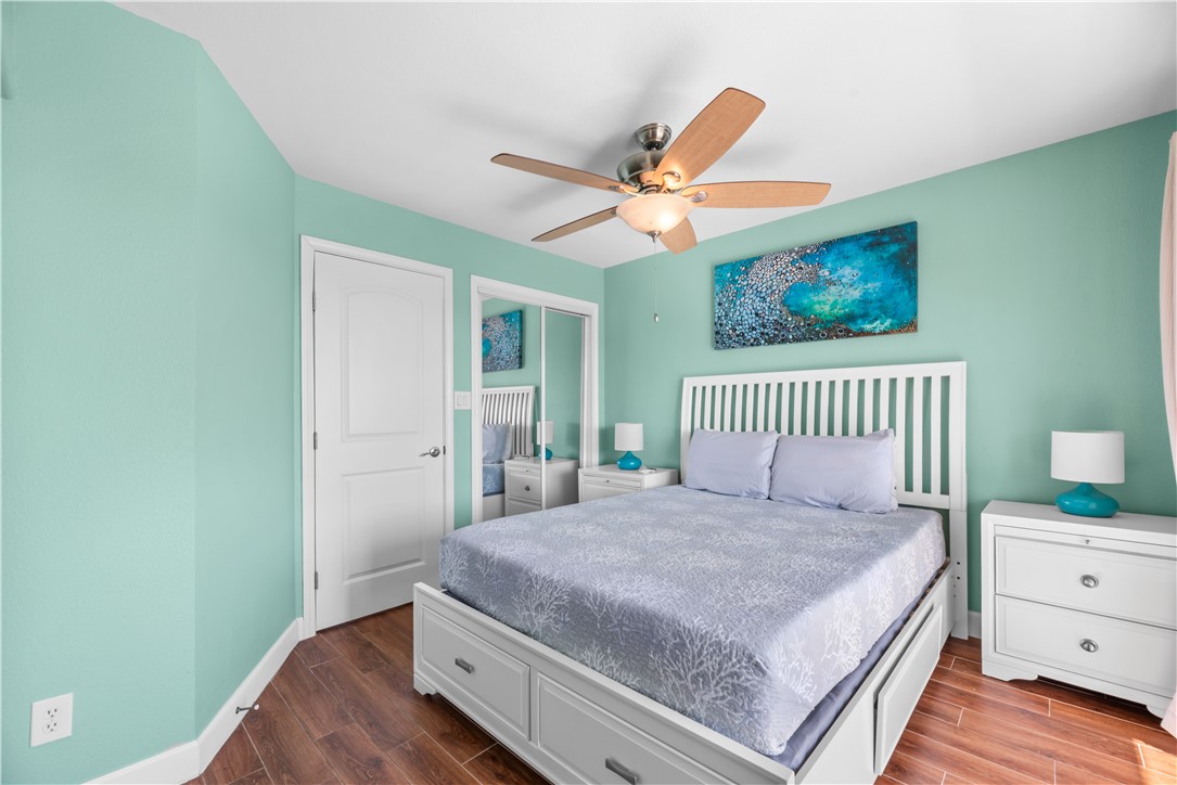 2290 North Fulton Beach Road, Unit 212 Rockport, TX 78382 - Photo 13 of 19 a bedroom with a bed and a window