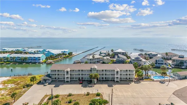 an aerial view of a house with a ocean view