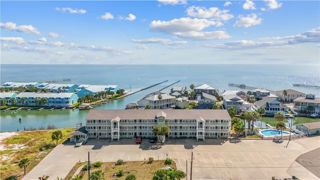 an aerial view of a house with a ocean view