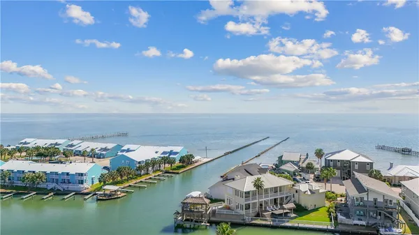 an aerial view of a house with a ocean view