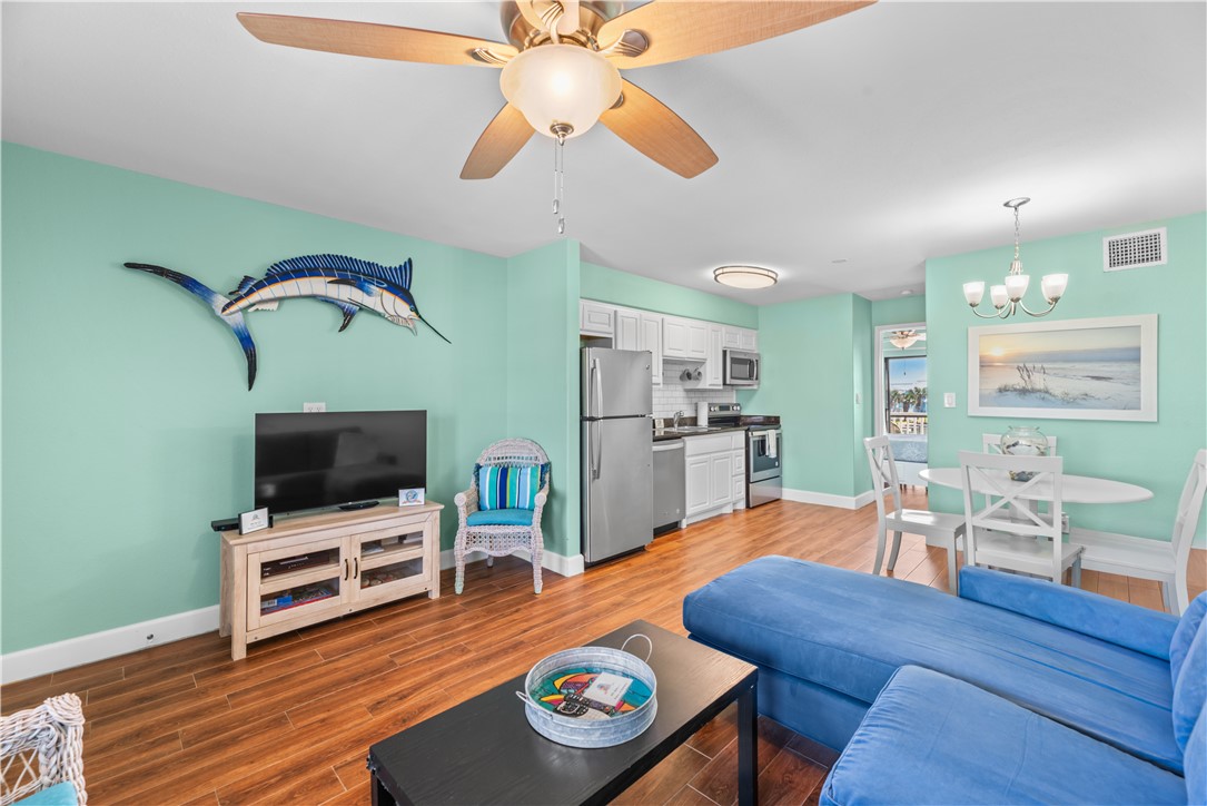 2290 North Fulton Beach Road, Unit 212 Rockport, TX 78382 - Photo 4 of 19 a living room with furniture and a flat screen tv