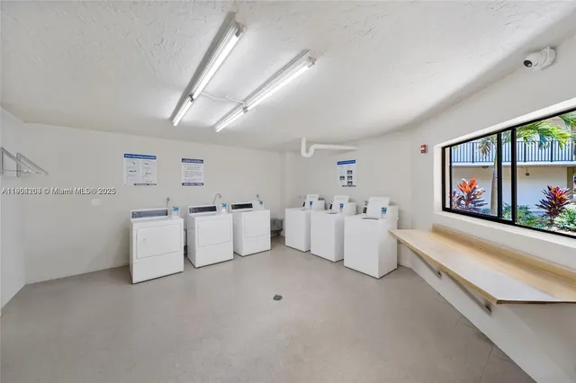 a view of a backyard with swimming pool