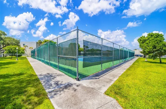 a view of a swimming pool with an outdoor seating
