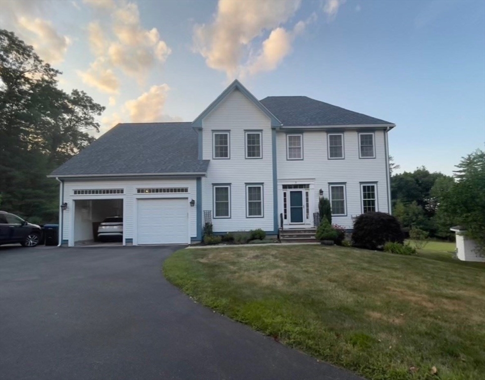 a view of a yard in front of a house with a yard