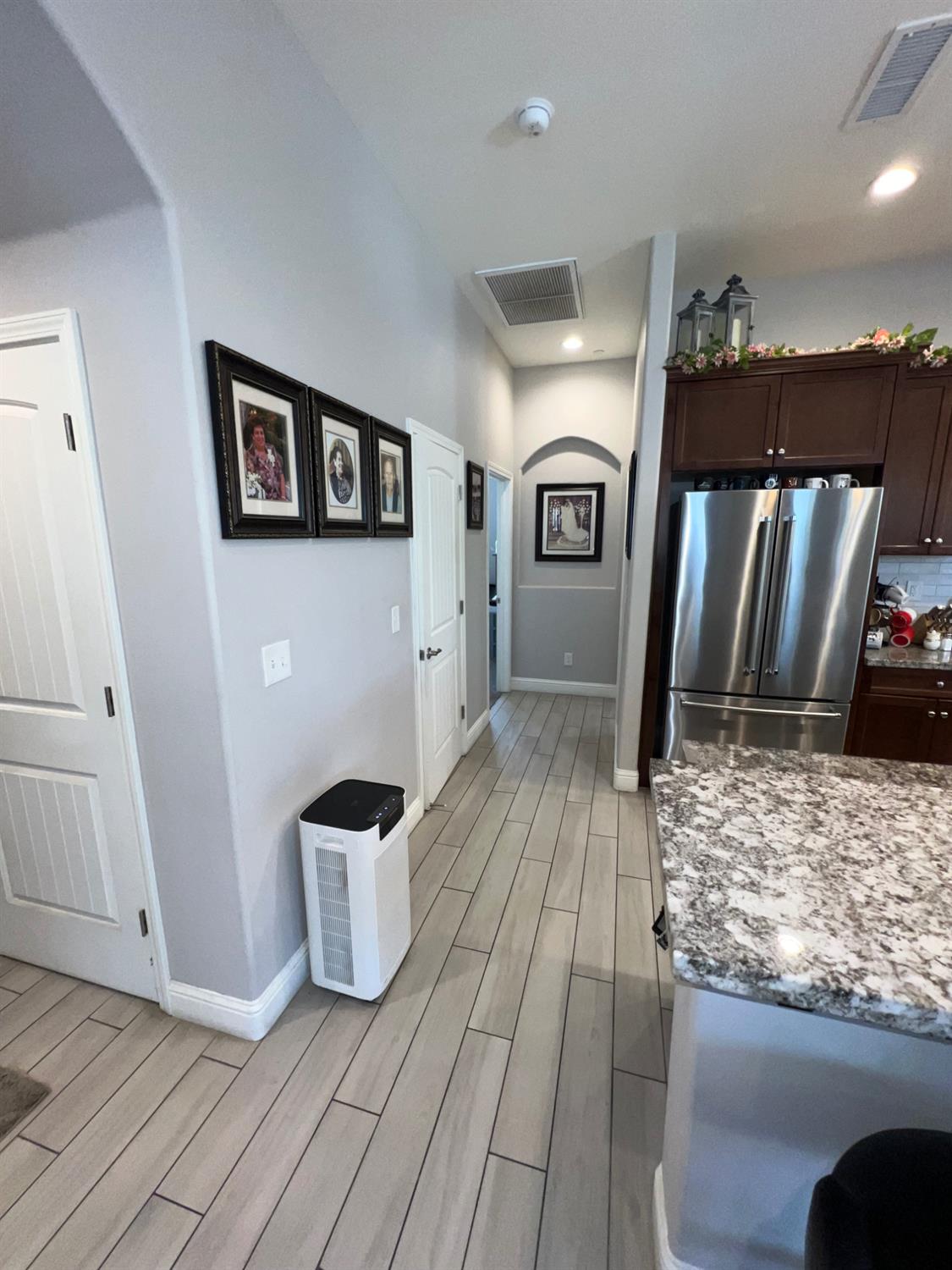 889 Coloma Place Madera, CA 93637 - Photo 24 of 61 a view of a living room and a wooden floor