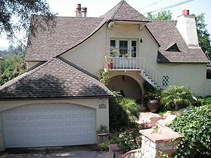 a aerial view of a house with a yard