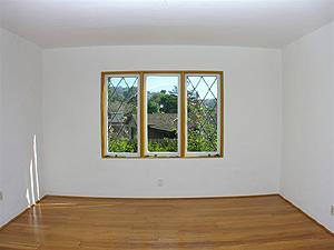857 Cheltenham Road Santa Barbara, CA 93105 - Photo 2 of 9 a view of an empty room with wooden floor and a window