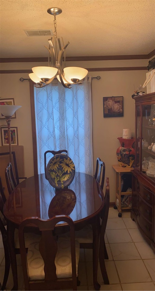 3894 Ross Road Memphis, TN 38115 - Photo 6 of 11 a dining room with furniture and chandelier