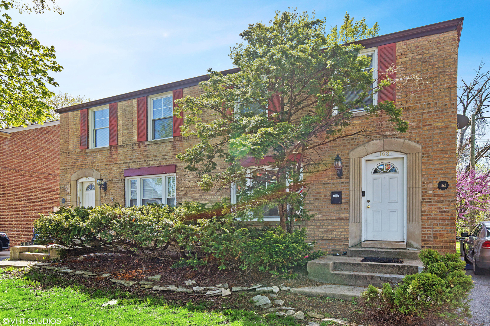 163 East Burlington Street Riverside, IL 60546 - Photo 1 of 7 front view of a house with a tree