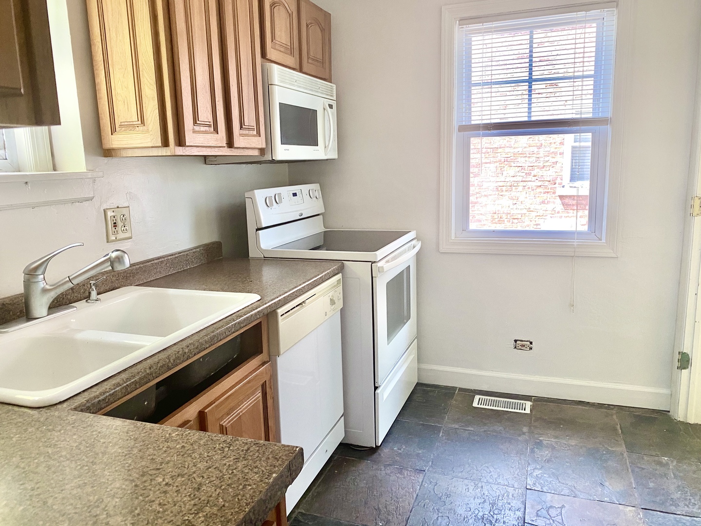 163 East Burlington Street Riverside, IL 60546 - Photo 4 of 7 a kitchen that has a sink and a stove