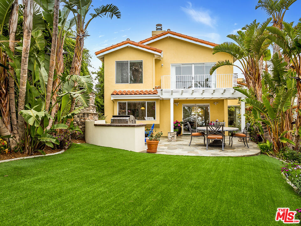 4324 Hillview Drive Malibu, CA 90265 - Photo 1 of 24 a view of a house with patio and a yard