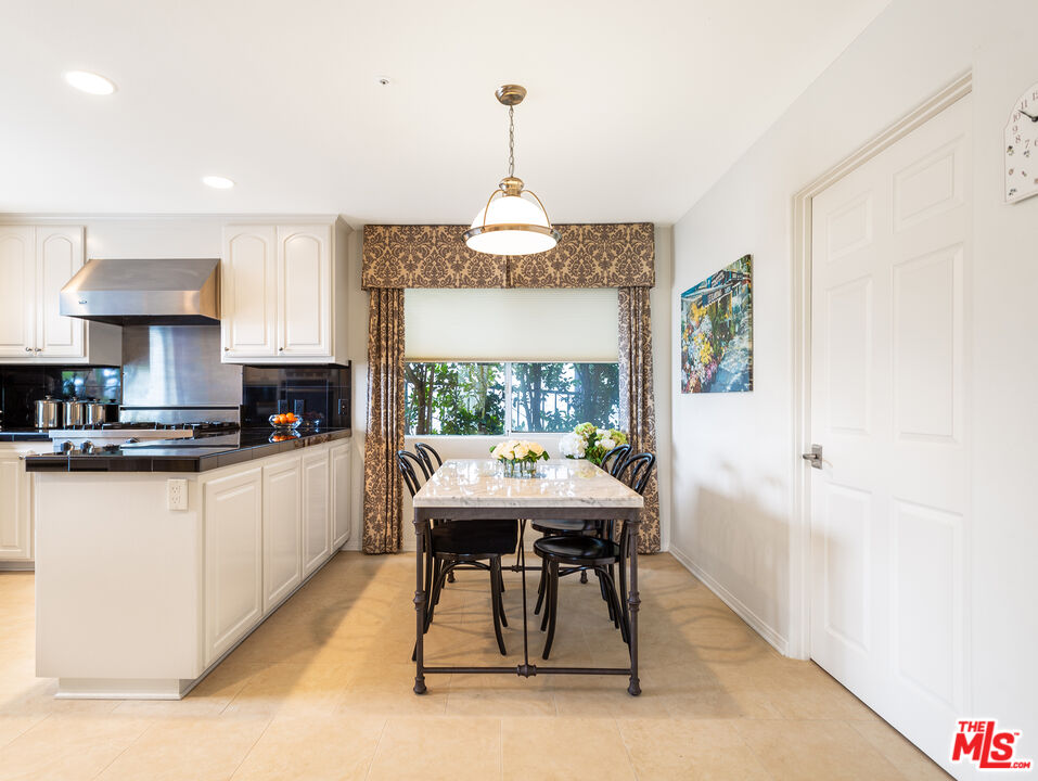 4324 Hillview Drive Malibu, CA 90265 - Photo 11 of 24 a view of a dining room with furniture window and wooden floor