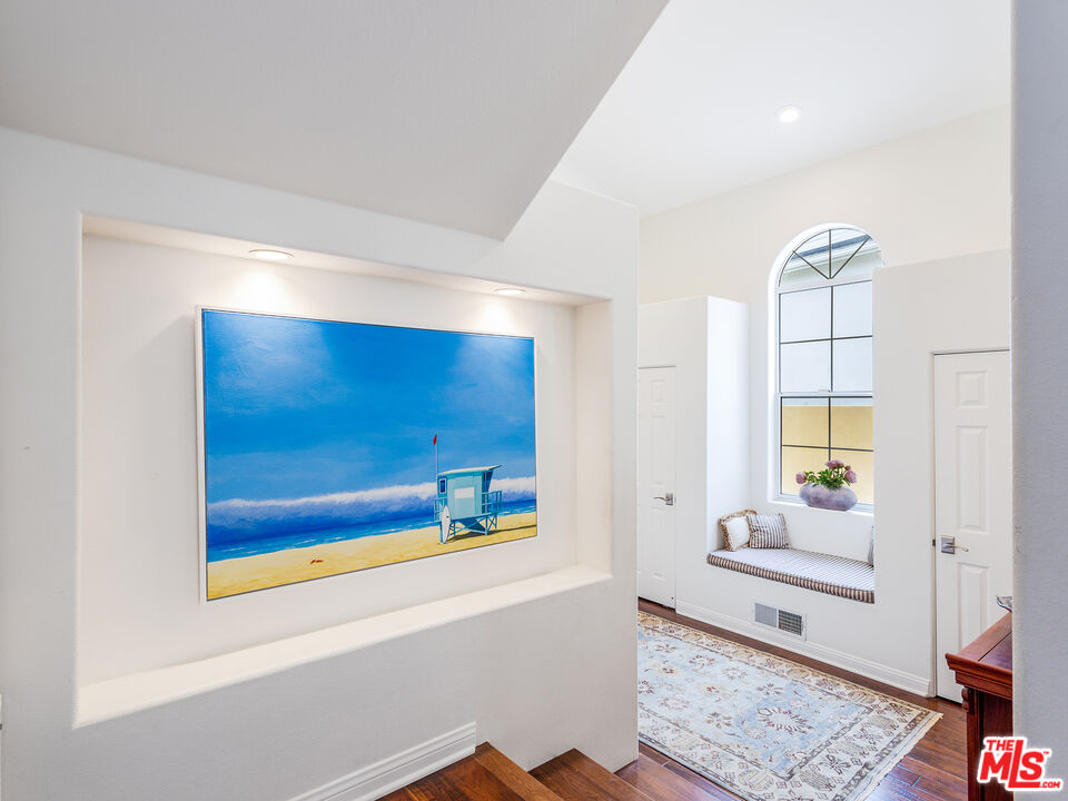 4324 Hillview Drive Malibu, CA 90265 - Photo 4 of 24 a view of a hallway with wooden floor and windows
