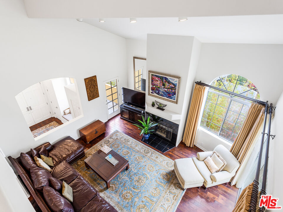 4324 Hillview Drive Malibu, CA 90265 - Photo 8 of 24 a living room with furniture and a flat screen tv
