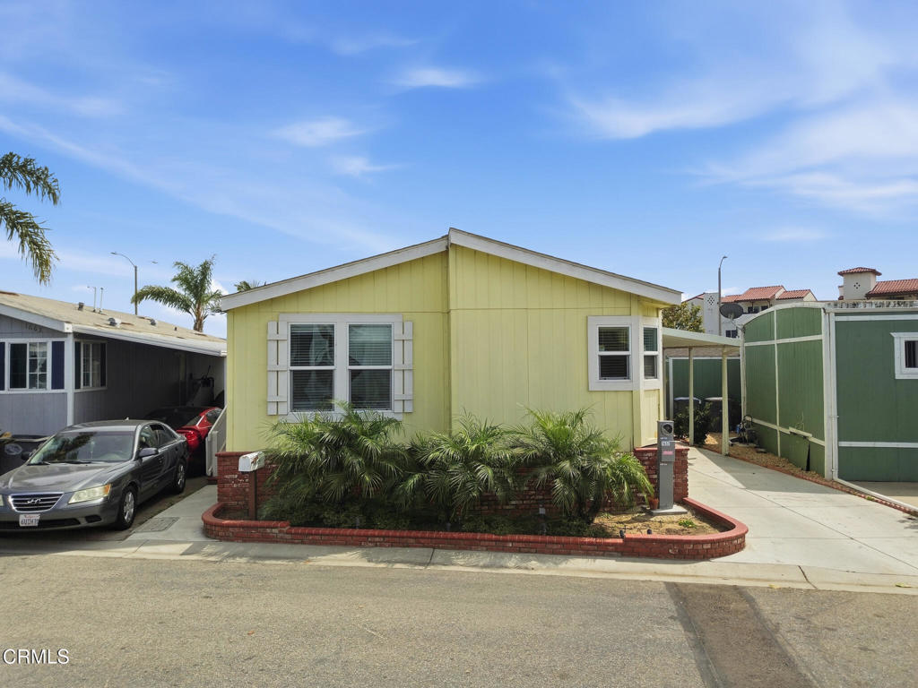 1657 Lime Avenue, Unit 87 Oxnard, CA 93033 - Photo 1 of 37 a front view of a house with a garden