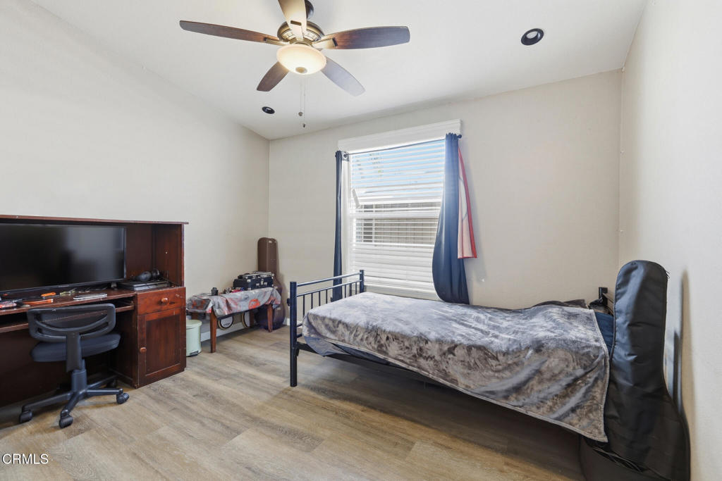 1657 Lime Avenue, Unit 87 Oxnard, CA 93033 - Photo 21 of 37 a bedroom with a bed and a flat screen tv