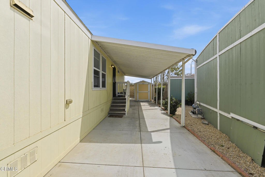 1657 Lime Avenue, Unit 87 Oxnard, CA 93033 - Photo 24 of 37 a view of a hallway with the glass door