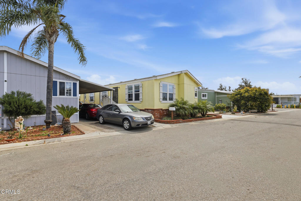 1657 Lime Avenue, Unit 87 Oxnard, CA 93033 - Photo 28 of 37 a view of a car parked in front of a house