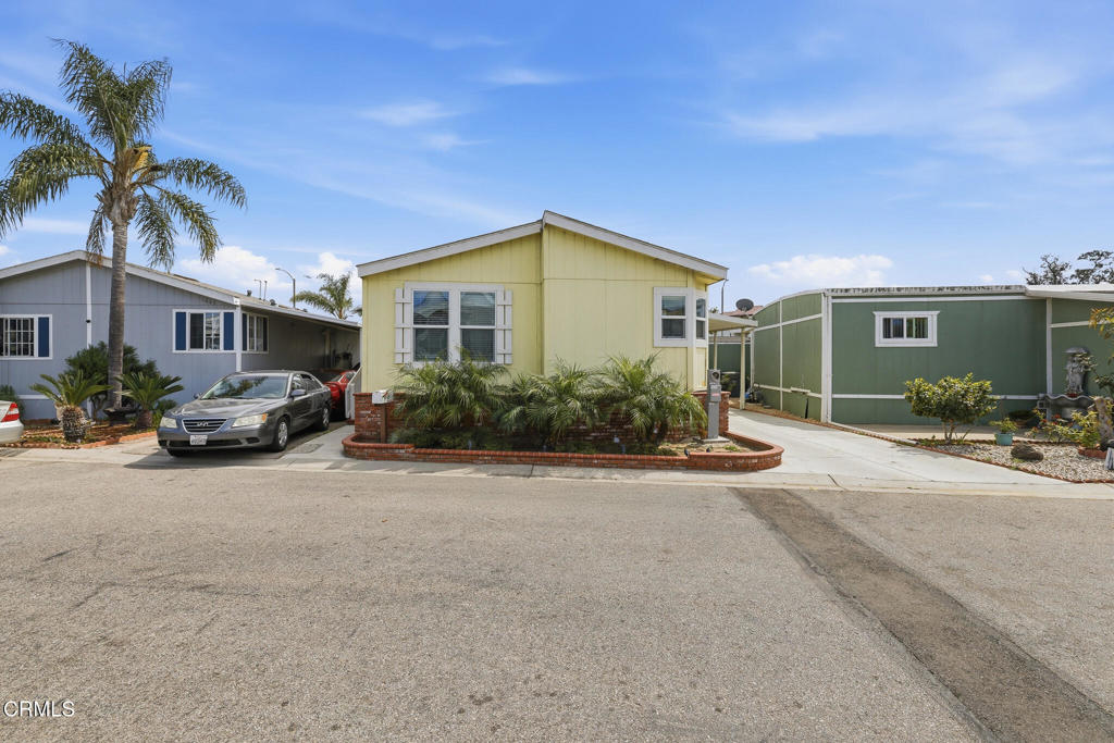 1657 Lime Avenue, Unit 87 Oxnard, CA 93033 - Photo 3 of 37 a front view of a house with garden and plants