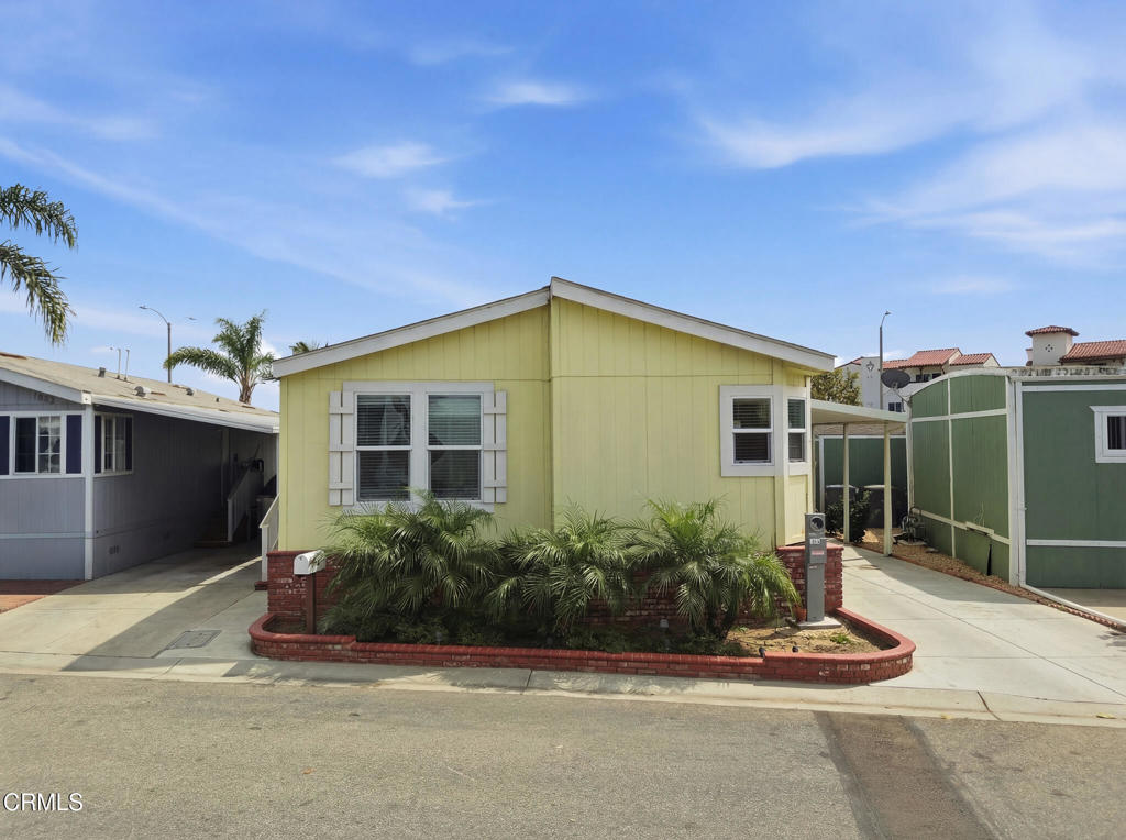 1657 Lime Avenue, Unit 87 Oxnard, CA 93033 - Photo 31 of 37 a front view of a house with a yard