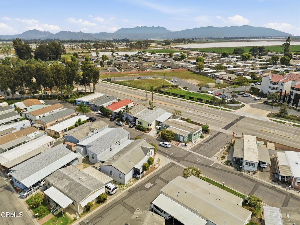 1657 Lime Avenue, Unit 87 Oxnard, CA 93033 - Photo 35 of 37 an aerial view of a city with lots of residential buildings and mountain view in back