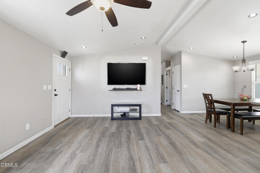 1657 Lime Avenue, Unit 87 Oxnard, CA 93033 - Photo 6 of 37 a living room with furniture and a flat screen tv