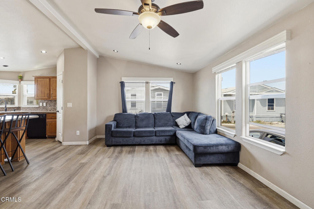 1657 Lime Avenue, Unit 87 Oxnard, CA 93033 - Photo 7 of 37 a living room with furniture and a wooden floor