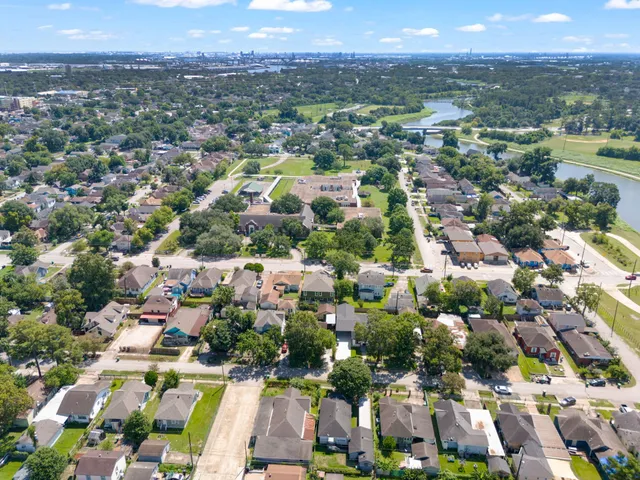 an aerial view of a house with a yard