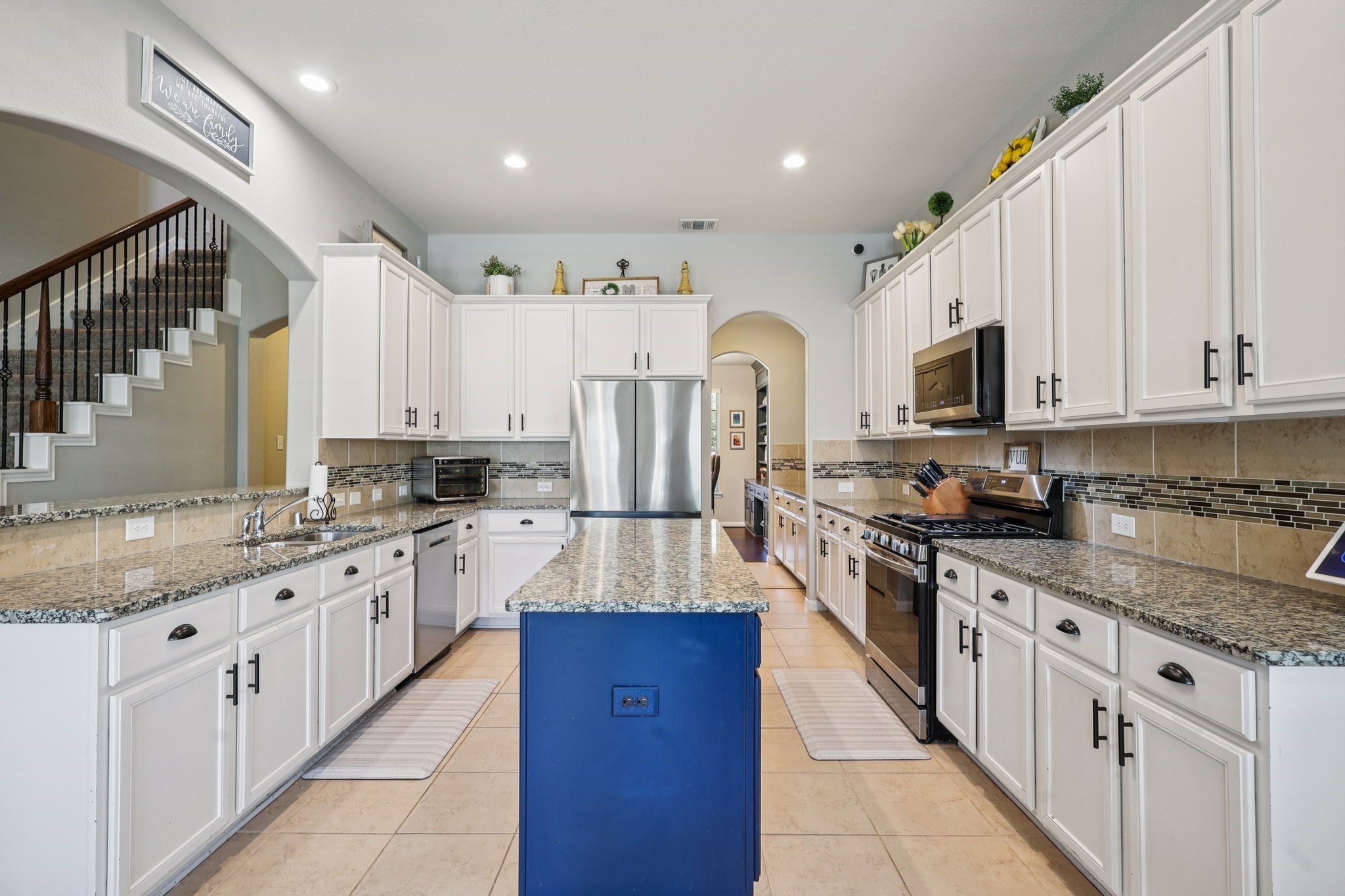 3663 Cottage Pines Lane Spring, TX 77386 - Photo 11 of 47 a large kitchen with stainless steel appliances granite countertop lots of white cabinets and a sink