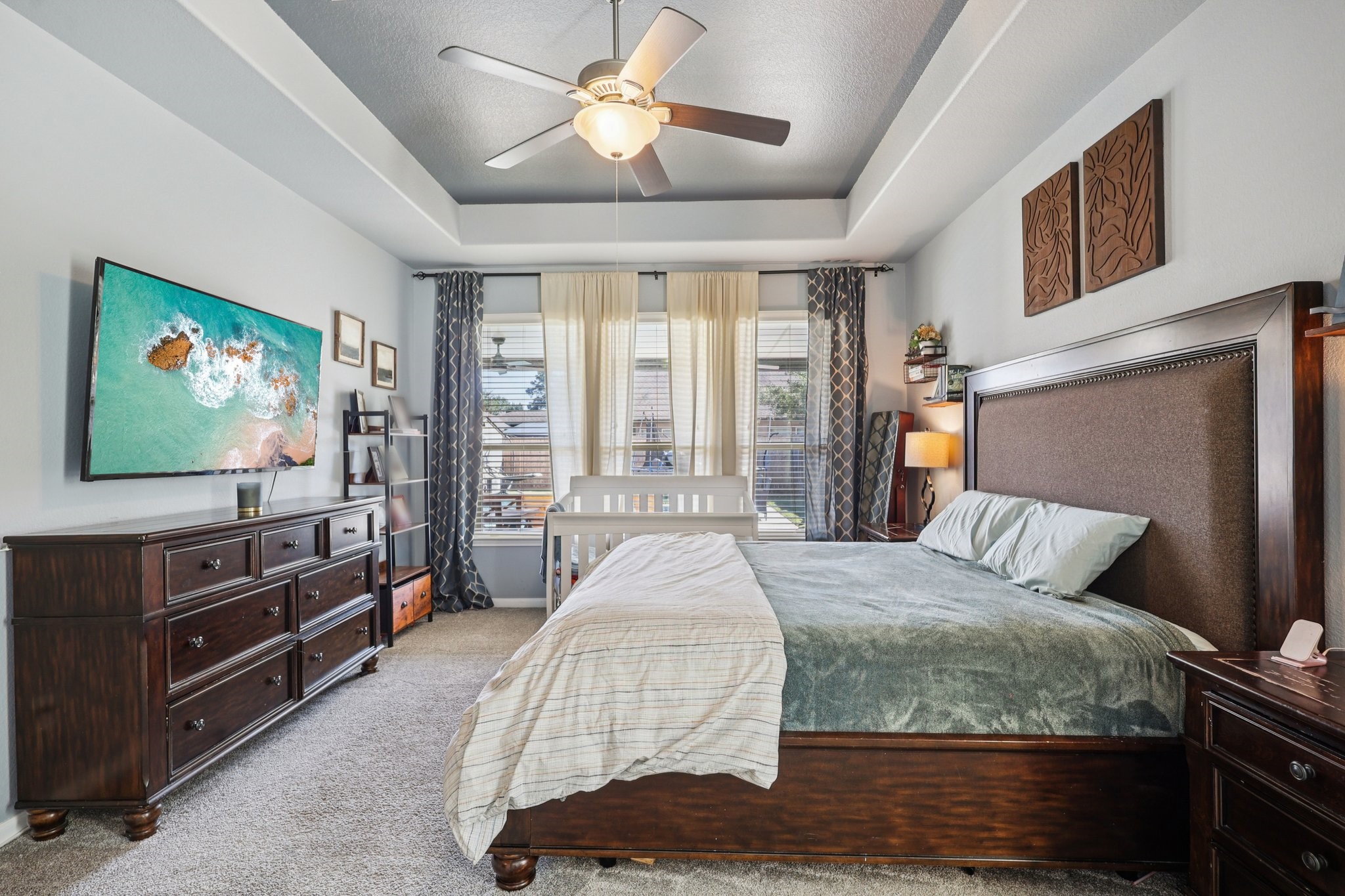 3663 Cottage Pines Lane Spring, TX 77386 - Photo 16 of 47 a bedroom with a bed and a flat screen tv