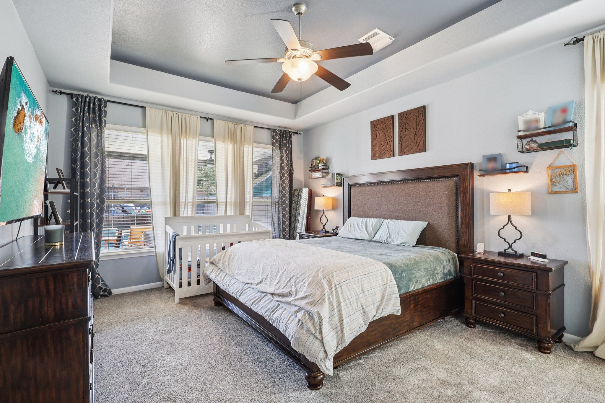 3663 Cottage Pines Lane Spring, TX 77386 - Photo 17 of 47 a bedroom with a bed and a chandelier