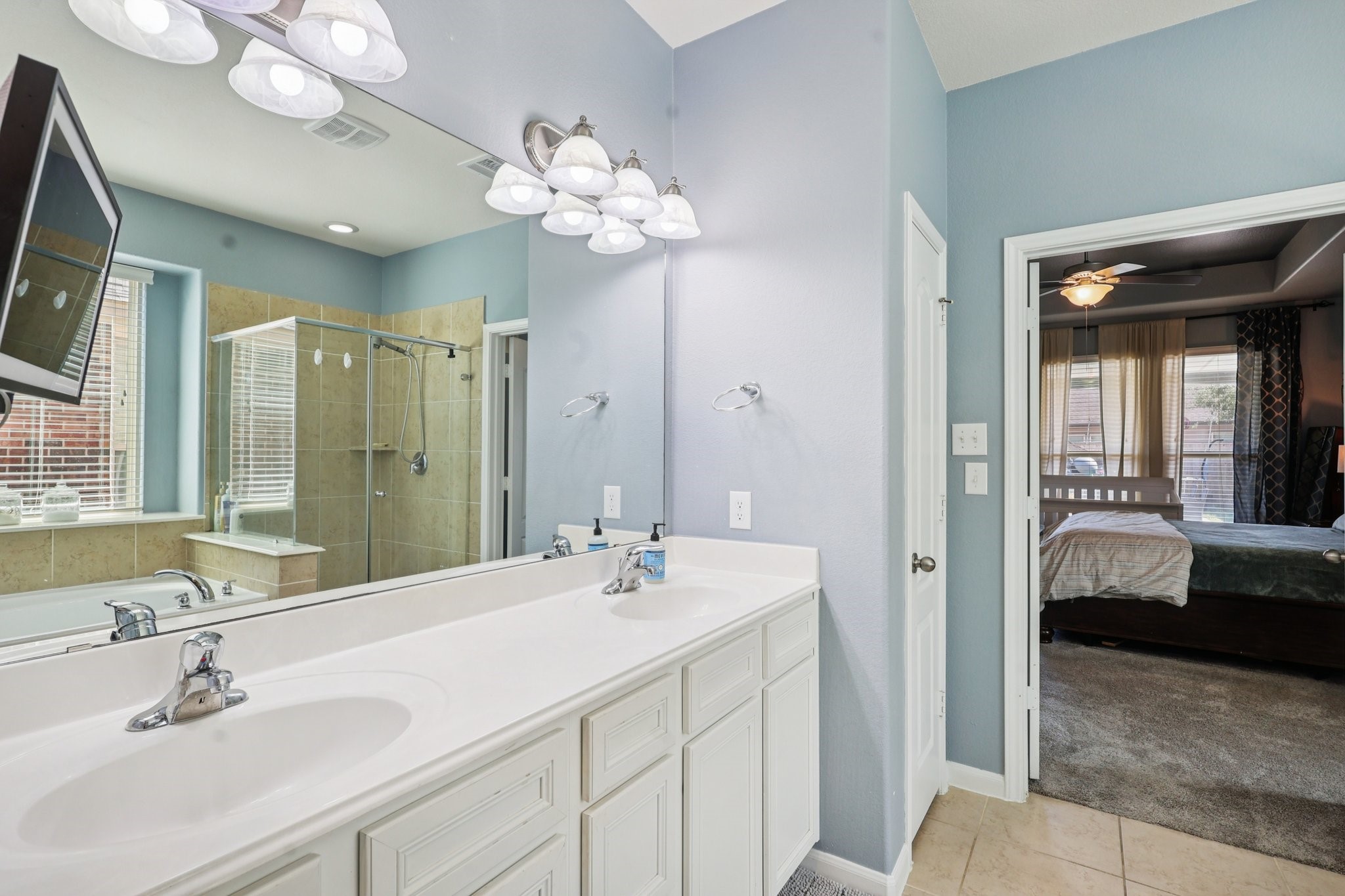 3663 Cottage Pines Lane Spring, TX 77386 - Photo 19 of 47 a en suite bathroom with a double vanity sink and a mirror