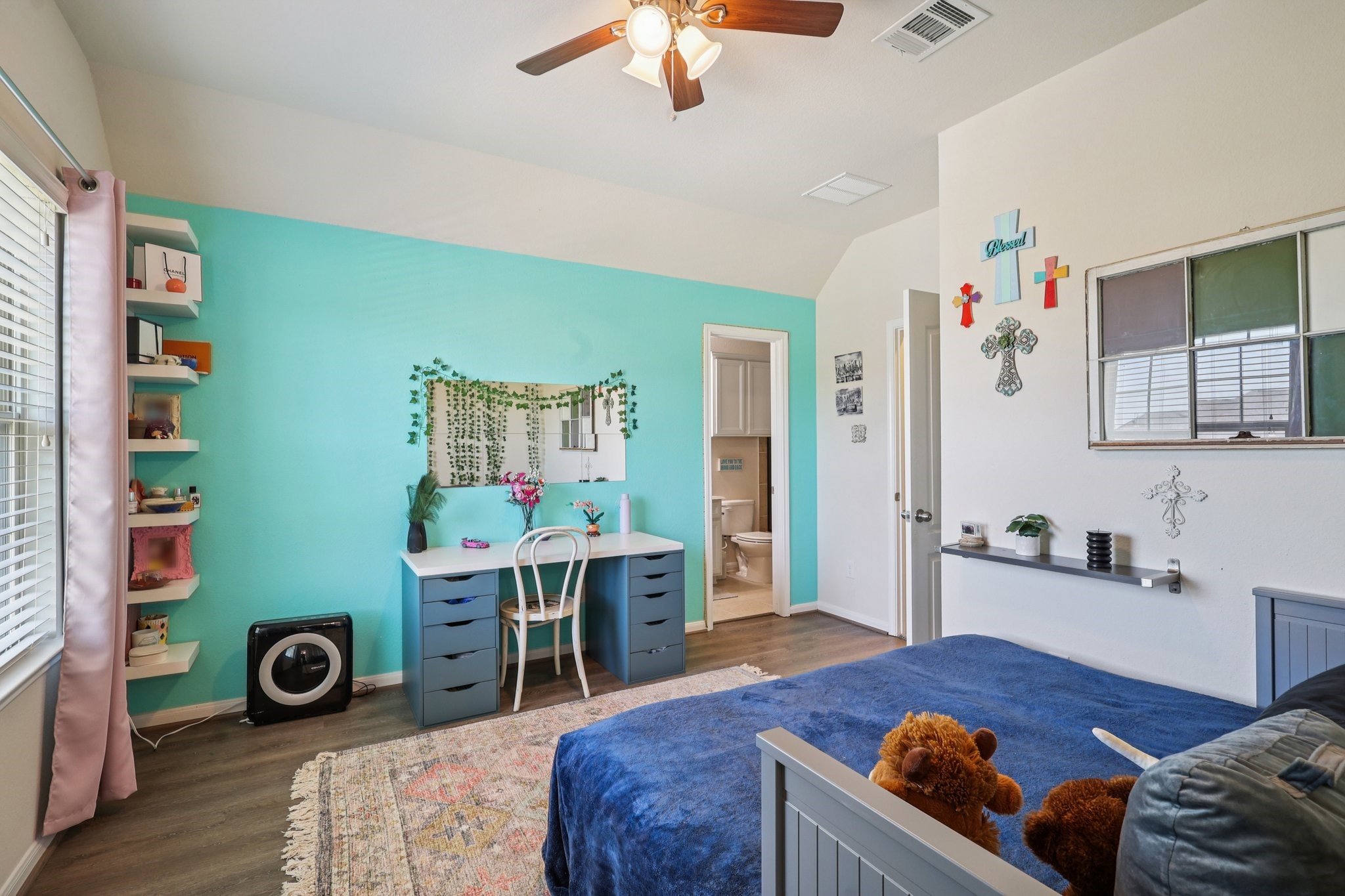 3663 Cottage Pines Lane Spring, TX 77386 - Photo 26 of 47 a bedroom with a bed and a chandelier