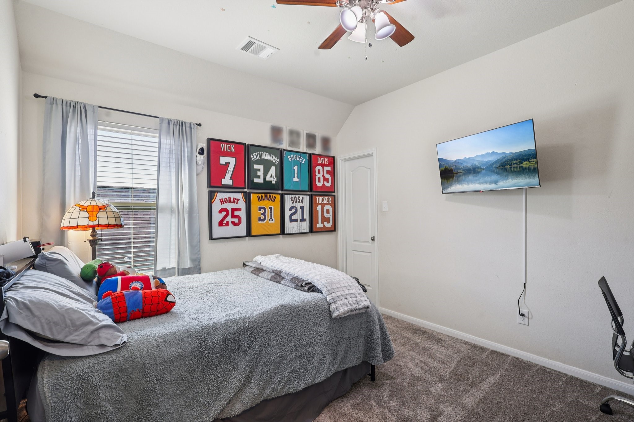 3663 Cottage Pines Lane Spring, TX 77386 - Photo 32 of 47 a bedroom with a bed and a chandelier