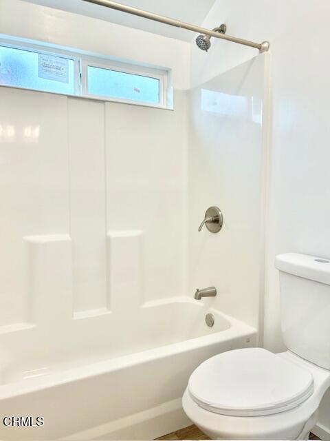 4614 Terrace Avenue, Unit JADU Oxnard, CA 93033 - Photo 6 of 16 a white toilet and tub sitting next to a bathroom sink
