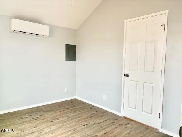an empty room with wooden floor