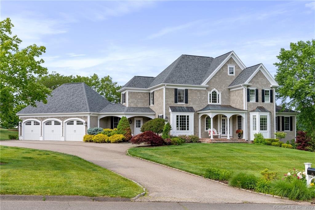 a front view of a house with a yard table and chairs