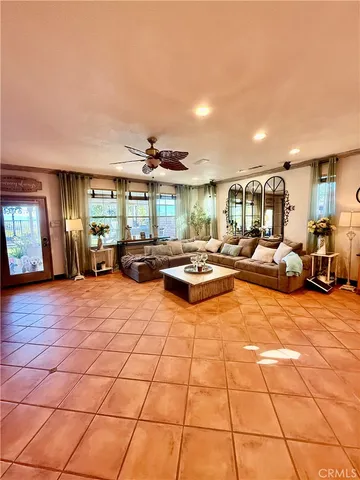 a large room with lots of chairs and chandelier