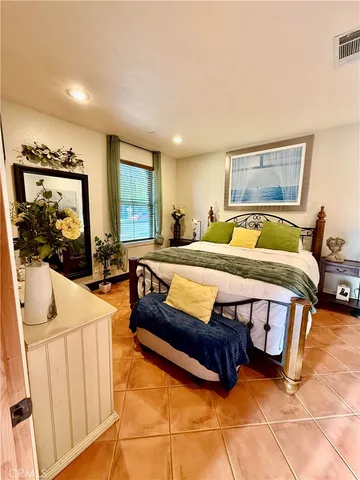 a bedroom with furniture and a window