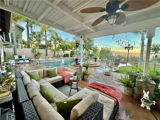 a outdoor living space with patio furniture and garden view