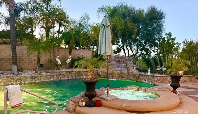 a view of a swimming pool with a patio