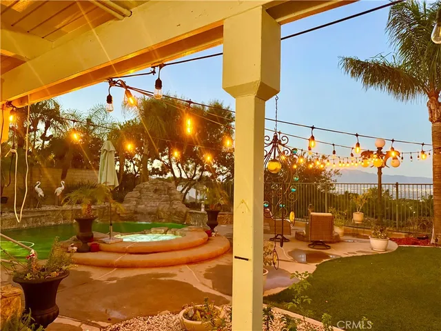 a living room with couches a table and chairs