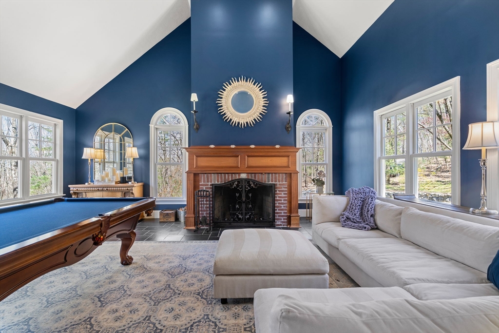 47 Brewster Road Sudbury, MA 01776 - Photo 11 of 41 a living room with furniture and a fireplace