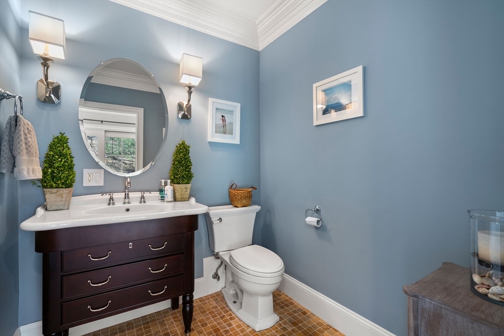 47 Brewster Road Sudbury, MA 01776 - Photo 18 of 41 a bathroom with a toilet a sink and mirror