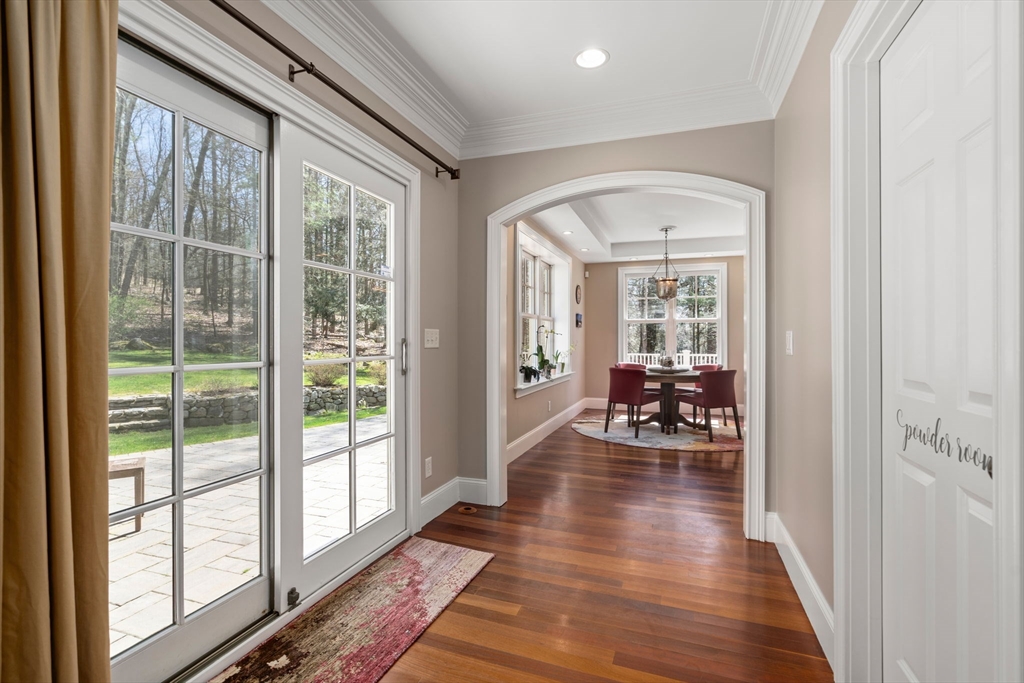 47 Brewster Road Sudbury, MA 01776 - Photo 19 of 41 a view of a livingroom with wooden floor and furniture