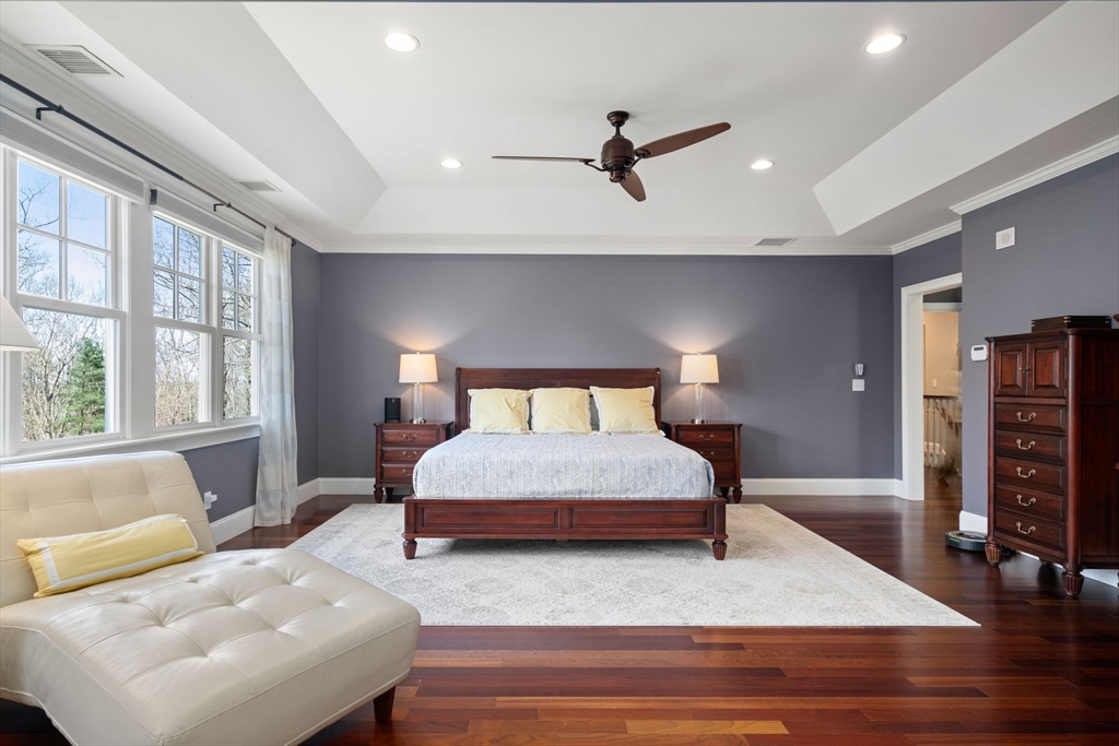 47 Brewster Road Sudbury, MA 01776 - Photo 21 of 41 a bedroom with a large bed and a couch