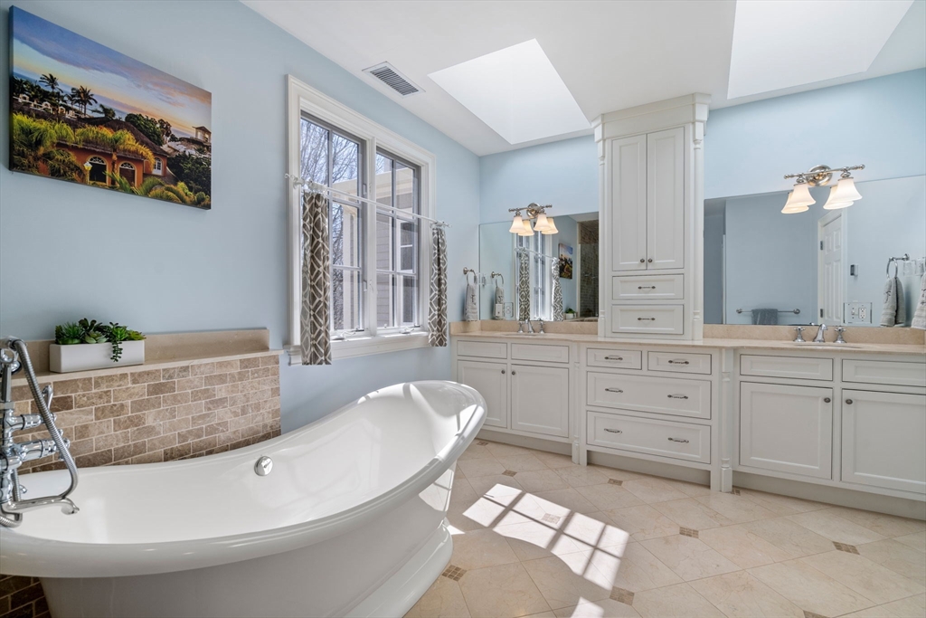 47 Brewster Road Sudbury, MA 01776 - Photo 22 of 41 a bathroom with a tub sink and mirror