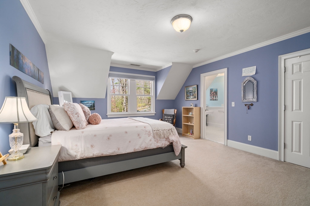 47 Brewster Road Sudbury, MA 01776 - Photo 25 of 41 a spacious bedroom with a bed and window