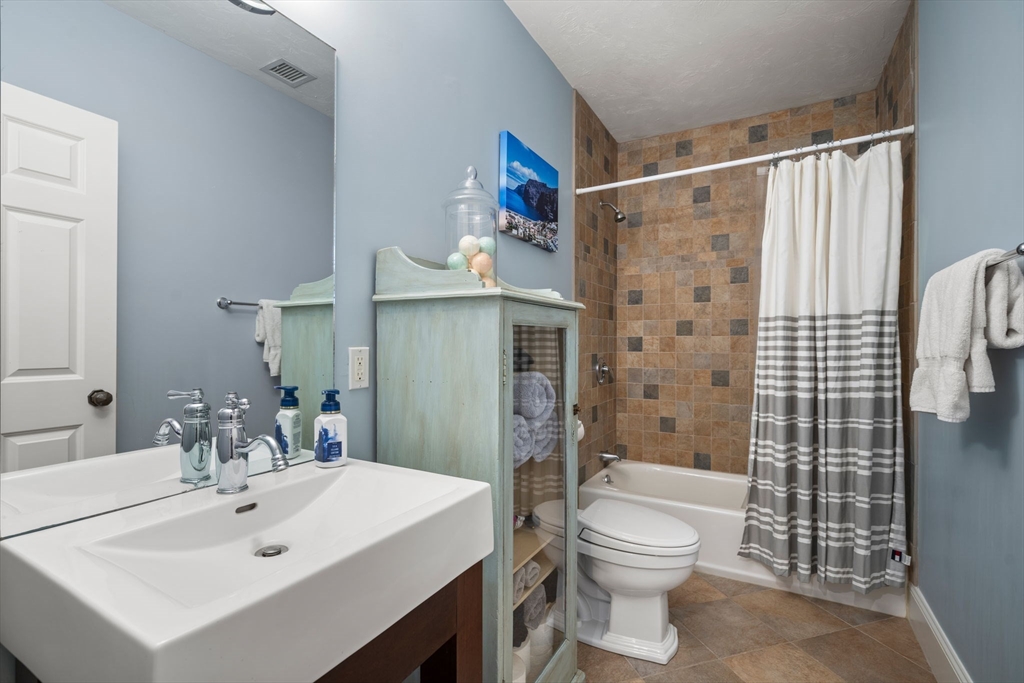 47 Brewster Road Sudbury, MA 01776 - Photo 26 of 41 a bathroom with a sink toilet and shower